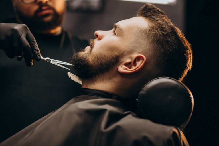 handsome-man-cutting-beard-barber-shop-salon